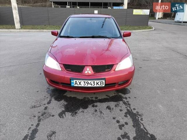 Червоний Міцубісі Lancer, об'ємом двигуна 1.58 л та пробігом 140 тис. км за 6000 $, фото 24 на Automoto.ua