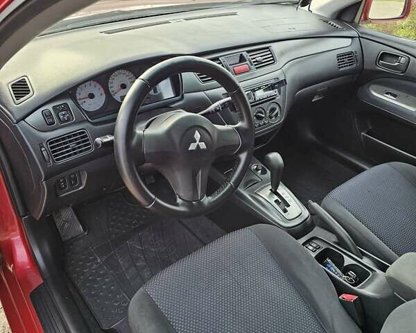 Червоний Міцубісі Lancer, об'ємом двигуна 1.6 л та пробігом 220 тис. км за 5800 $, фото 7 на Automoto.ua