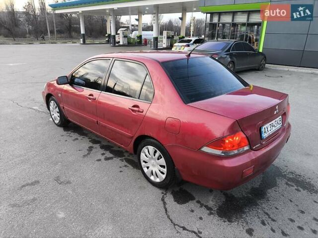 Червоний Міцубісі Lancer, об'ємом двигуна 1.58 л та пробігом 140 тис. км за 6000 $, фото 17 на Automoto.ua