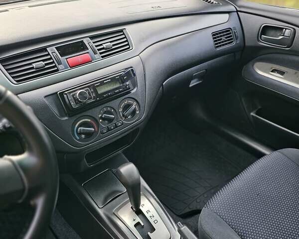 Червоний Міцубісі Lancer, об'ємом двигуна 1.6 л та пробігом 220 тис. км за 5800 $, фото 10 на Automoto.ua