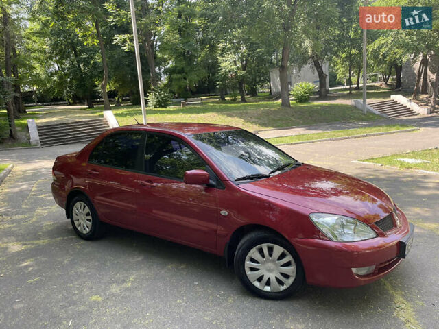 Червоний Міцубісі Lancer, об'ємом двигуна 1.6 л та пробігом 270 тис. км за 5699 $, фото 2 на Automoto.ua