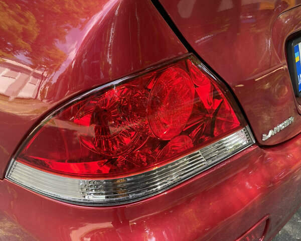 Червоний Міцубісі Lancer, об'ємом двигуна 1.6 л та пробігом 270 тис. км за 5699 $, фото 27 на Automoto.ua