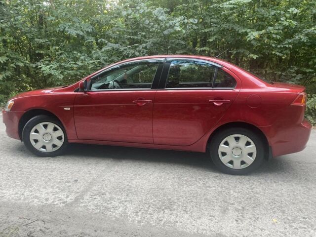 Красный Мицубиси Лансер, объемом двигателя 1.5 л и пробегом 124 тыс. км за 6300 $, фото 1 на Automoto.ua