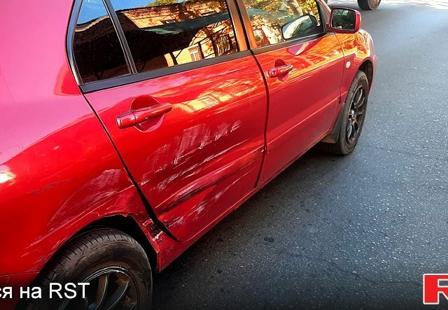 Червоний Міцубісі Lancer, об'ємом двигуна 1.6 л та пробігом 266 тис. км за 2900 $, фото 7 на Automoto.ua
