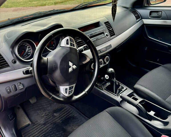 Красный Мицубиси Лансер, объемом двигателя 2 л и пробегом 365 тыс. км за 5000 $, фото 12 на Automoto.ua