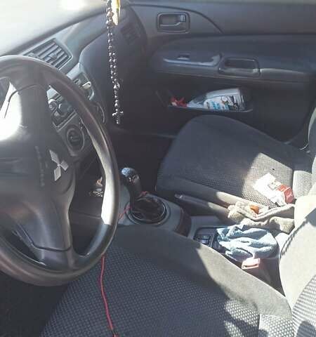 Мицубиси Лансер 2008 в Львове на Automoto.ua Красный Мицубиси Лансер, объемом двигателя 1.58 л и пробегом 280 тыс. км за 3200 $, фото 13 на Automoto.ua