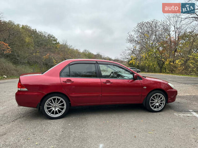 Красный Мицубиси Лансер, объемом двигателя 1.6 л и пробегом 192 тыс. км за 5999 $, фото 6 на Automoto.ua