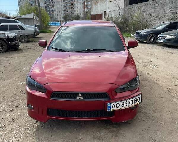 Красный Мицубиси Лансер, объемом двигателя 2 л и пробегом 327 тыс. км за 6000 $, фото 1 на Automoto.ua