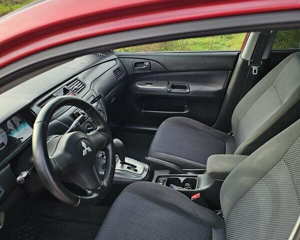 Червоний Міцубісі Lancer, об'ємом двигуна 1.6 л та пробігом 220 тис. км за 5800 $, фото 8 на Automoto.ua