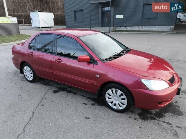 Червоний Міцубісі Lancer, об'ємом двигуна 1.58 л та пробігом 140 тис. км за 6000 $, фото 19 на Automoto.ua