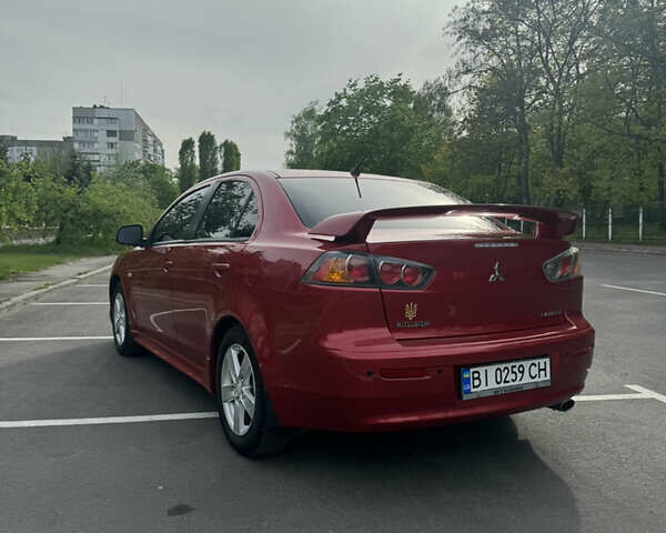 Червоний Міцубісі Lancer, об'ємом двигуна 2 л та пробігом 188 тис. км за 7390 $, фото 5 на Automoto.ua