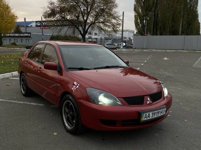 Червоний Міцубісі Lancer, об'ємом двигуна 1.6 л та пробігом 385 тис. км за 4500 $, фото 3 на Automoto.ua