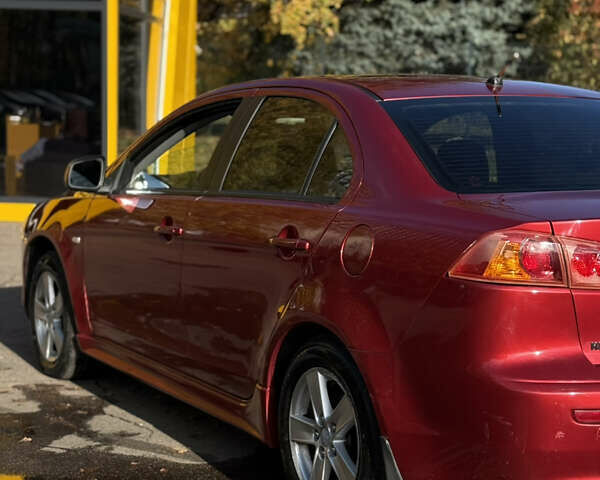 Червоний Міцубісі Lancer, об'ємом двигуна 2 л та пробігом 215 тис. км за 6500 $, фото 28 на Automoto.ua