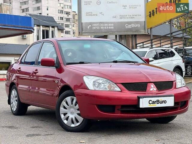 Червоний Міцубісі Lancer, об'ємом двигуна 1.58 л та пробігом 223 тис. км за 6400 $, фото 1 на Automoto.ua