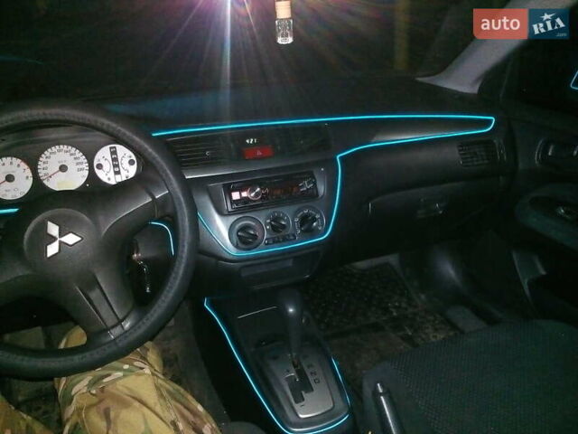 Червоний Міцубісі Lancer, об'ємом двигуна 1.6 л та пробігом 242 тис. км за 5100 $, фото 8 на Automoto.ua