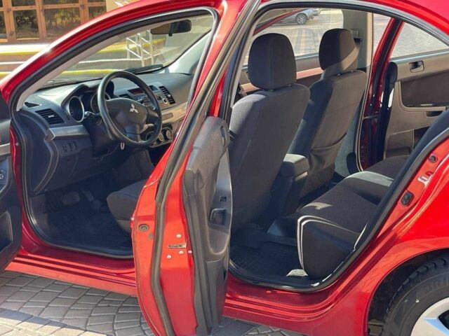 Червоний Міцубісі Lancer, об'ємом двигуна 1.5 л та пробігом 211 тис. км за 6900 $, фото 5 на Automoto.ua