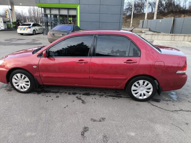 Червоний Міцубісі Lancer, об'ємом двигуна 1.6 л та пробігом 140 тис. км за 6000 $, фото 5 на Automoto.ua