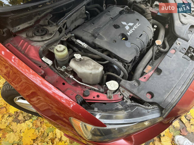 Червоний Міцубісі Lancer, об'ємом двигуна 2 л та пробігом 203 тис. км за 8000 $, фото 36 на Automoto.ua