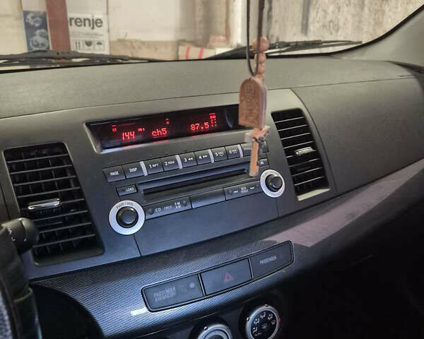 Красный Мицубиси Лансер, объемом двигателя 2 л и пробегом 65 тыс. км за 9300 $, фото 19 на Automoto.ua