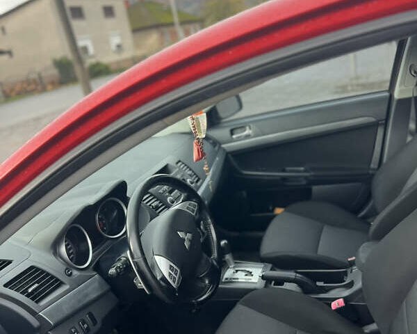 Червоний Міцубісі Lancer, об'ємом двигуна 2 л та пробігом 150 тис. км за 7000 $, фото 9 на Automoto.ua