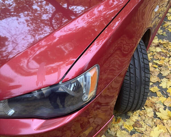 Червоний Міцубісі Lancer, об'ємом двигуна 2 л та пробігом 203 тис. км за 8000 $, фото 32 на Automoto.ua