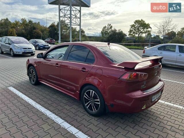 Красный Мицубиси Лансер, объемом двигателя 2 л и пробегом 227 тыс. км за 7000 $, фото 4 на Automoto.ua
