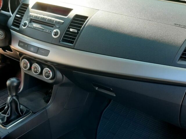 Красный Мицубиси Лансер, объемом двигателя 2 л и пробегом 110 тыс. км за 7500 $, фото 20 на Automoto.ua