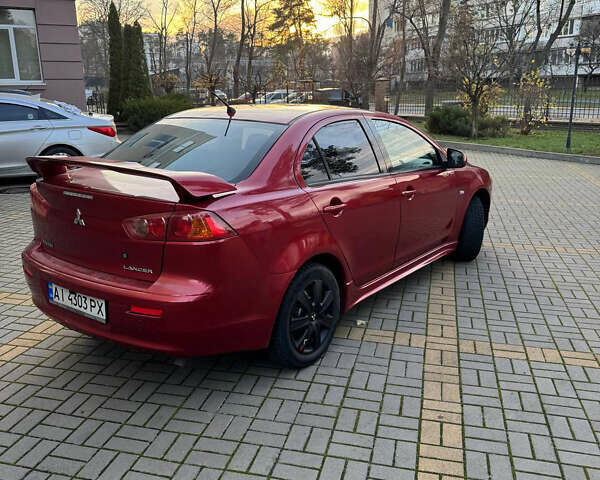 Красный Мицубиси Лансер, объемом двигателя 2 л и пробегом 143 тыс. км за 5200 $, фото 9 на Automoto.ua