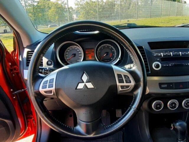 Красный Мицубиси Лансер, объемом двигателя 2 л и пробегом 110 тыс. км за 7500 $, фото 13 на Automoto.ua