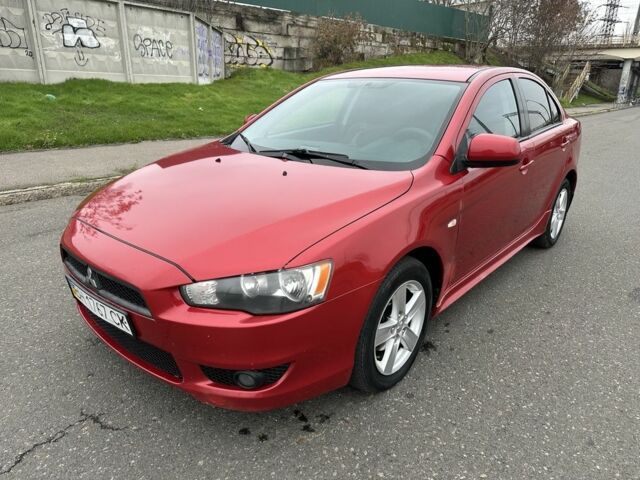 Красный Мицубиси Лансер, объемом двигателя 2 л и пробегом 366 тыс. км за 6500 $, фото 2 на Automoto.ua