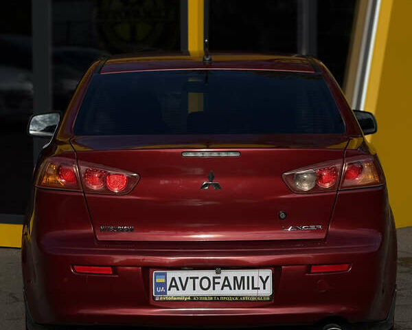 Червоний Міцубісі Lancer, об'ємом двигуна 2 л та пробігом 215 тис. км за 6500 $, фото 3 на Automoto.ua