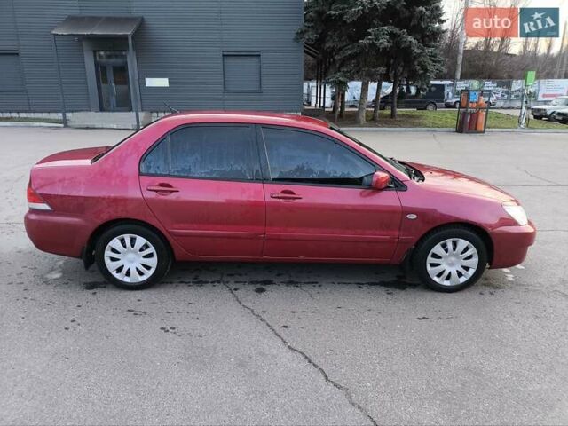 Червоний Міцубісі Lancer, об'ємом двигуна 1.58 л та пробігом 140 тис. км за 6000 $, фото 4 на Automoto.ua