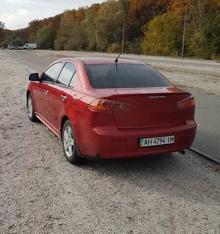 Червоний Міцубісі Lancer, об'ємом двигуна 2 л та пробігом 217 тис. км за 7100 $, фото 3 на Automoto.ua