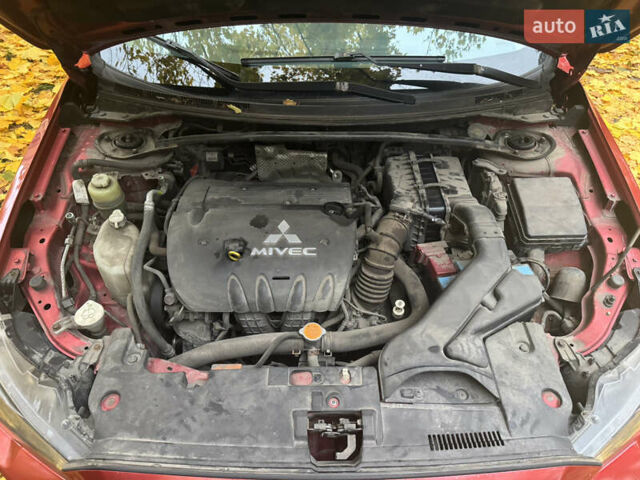 Червоний Міцубісі Lancer, об'ємом двигуна 2 л та пробігом 203 тис. км за 8000 $, фото 33 на Automoto.ua