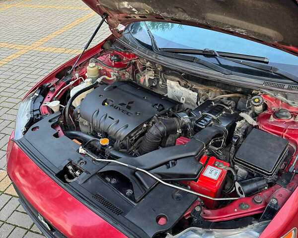 Красный Мицубиси Лансер, объемом двигателя 2 л и пробегом 143 тыс. км за 5200 $, фото 13 на Automoto.ua