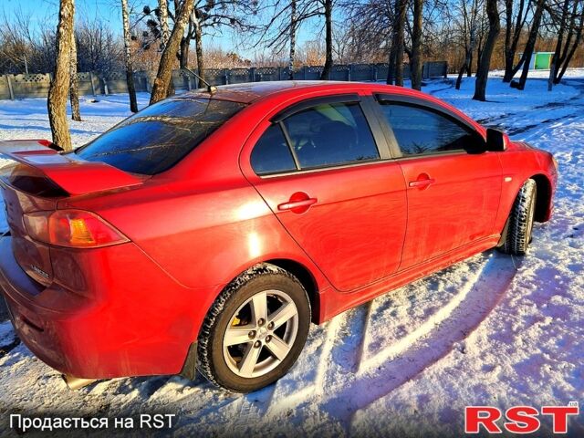 Красный Мицубиси Лансер, объемом двигателя 2 л и пробегом 200 тыс. км за 5500 $, фото 2 на Automoto.ua
