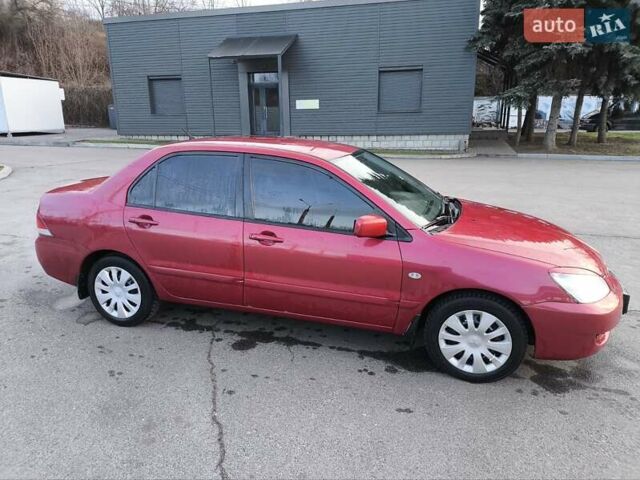 Червоний Міцубісі Lancer, об'ємом двигуна 1.58 л та пробігом 140 тис. км за 6000 $, фото 22 на Automoto.ua