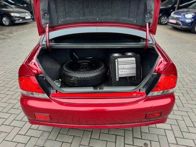 Красный Мицубиси Лансер, объемом двигателя 1.6 л и пробегом 215 тыс. км за 4500 $, фото 8 на Automoto.ua