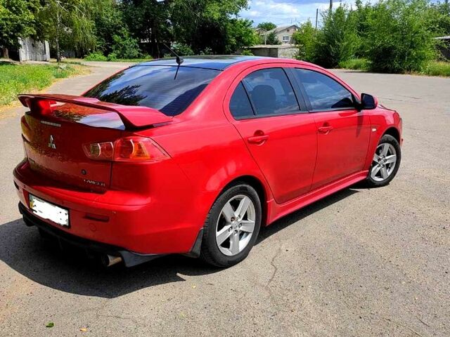 Красный Мицубиси Лансер, объемом двигателя 2 л и пробегом 300 тыс. км за 6200 $, фото 3 на Automoto.ua