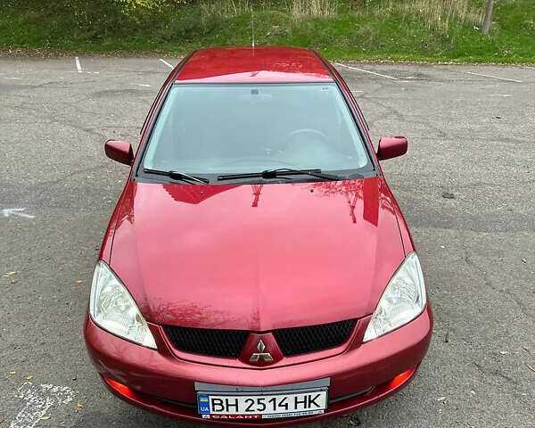 Красный Мицубиси Лансер, объемом двигателя 1.6 л и пробегом 192 тыс. км за 5999 $, фото 9 на Automoto.ua