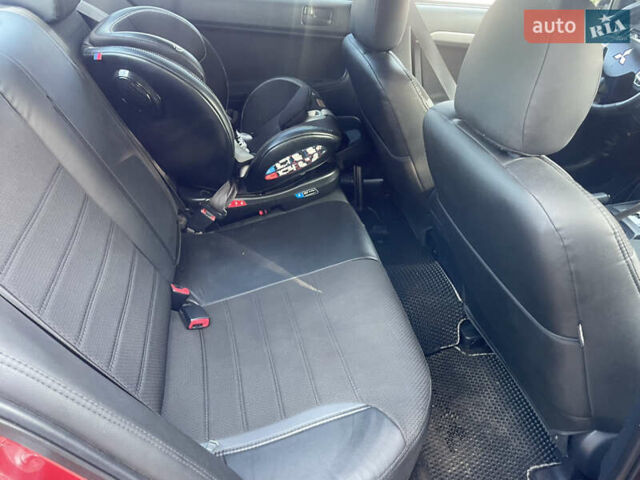 Червоний Міцубісі Lancer, об'ємом двигуна 2 л та пробігом 179 тис. км за 6499 $, фото 12 на Automoto.ua