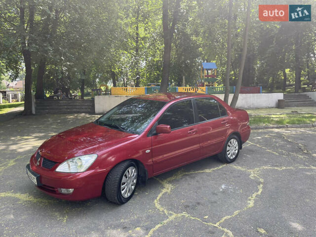 Червоний Міцубісі Lancer, об'ємом двигуна 1.6 л та пробігом 270 тис. км за 5699 $, фото 8 на Automoto.ua