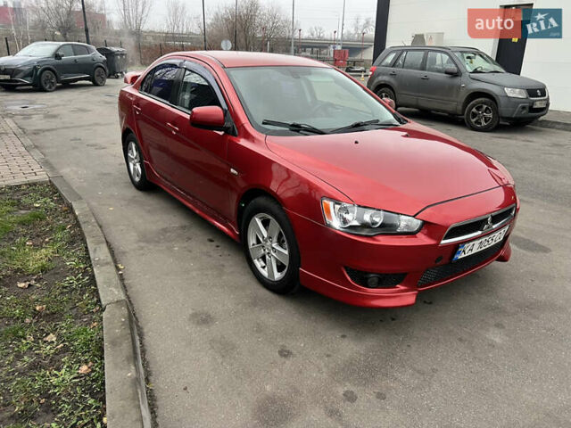 Красный Мицубиси Лансер, объемом двигателя 2 л и пробегом 330 тыс. км за 5250 $, фото 3 на Automoto.ua