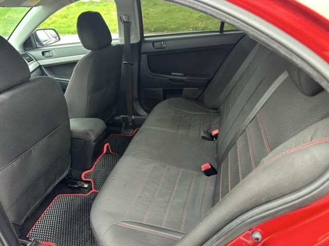 Красный Мицубиси Лансер, объемом двигателя 2 л и пробегом 366 тыс. км за 6500 $, фото 8 на Automoto.ua