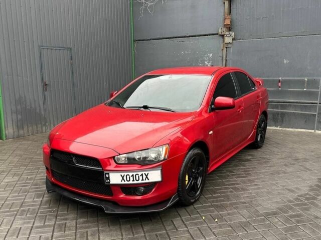 Червоний Міцубісі Lancer, об'ємом двигуна 2 л та пробігом 137 тис. км за 8500 $, фото 2 на Automoto.ua