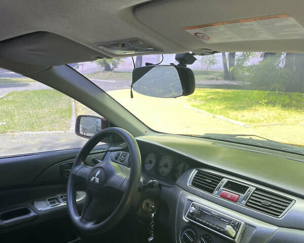 Червоний Міцубісі Lancer, об'ємом двигуна 1.6 л та пробігом 270 тис. км за 5699 $, фото 56 на Automoto.ua