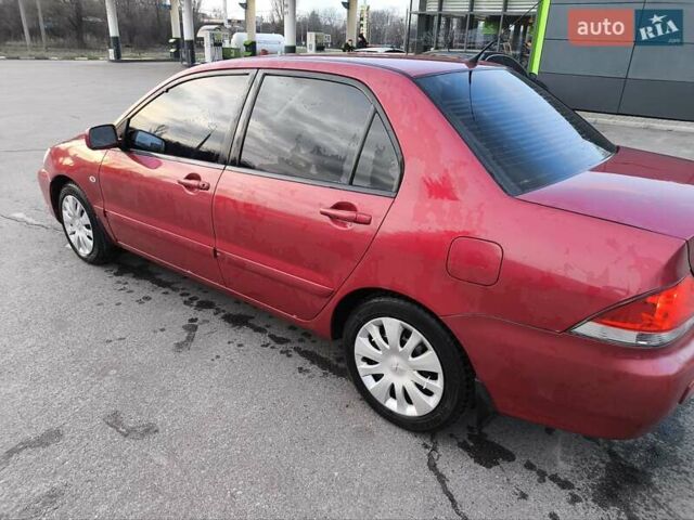 Червоний Міцубісі Lancer, об'ємом двигуна 1.58 л та пробігом 140 тис. км за 6000 $, фото 8 на Automoto.ua