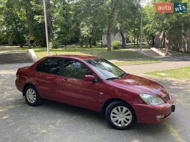 Червоний Міцубісі Lancer, об'ємом двигуна 1.6 л та пробігом 270 тис. км за 5699 $, фото 5 на Automoto.ua