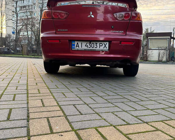 Красный Мицубиси Лансер, объемом двигателя 2 л и пробегом 143 тыс. км за 5200 $, фото 25 на Automoto.ua
