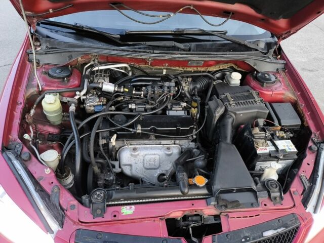 Червоний Міцубісі Lancer, об'ємом двигуна 1.6 л та пробігом 140 тис. км за 6000 $, фото 21 на Automoto.ua